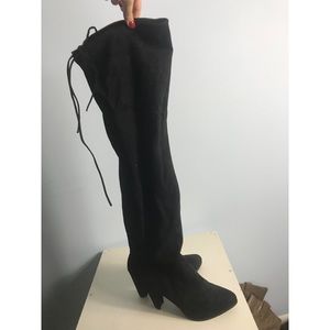 Thigh high black heeled boots